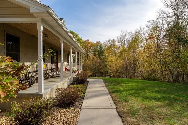 a view of a patio with table and chairs and potted plants