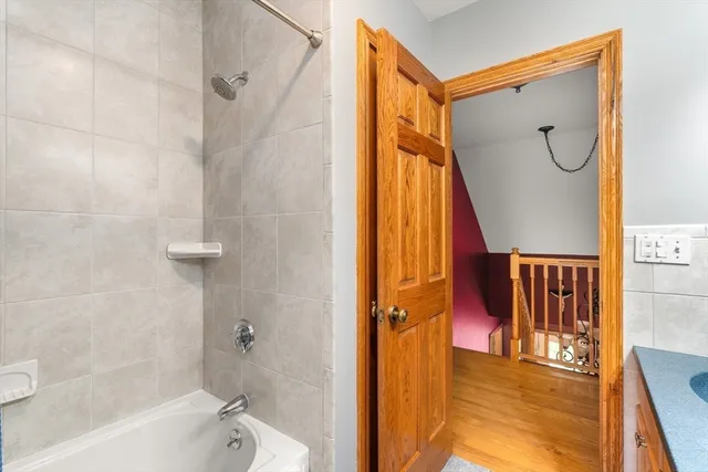 a bathroom with a tub and a shower