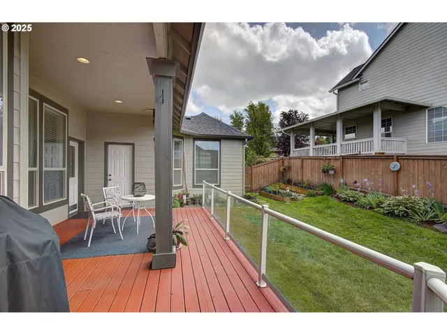 a view of a house with backyard porch and furniture
