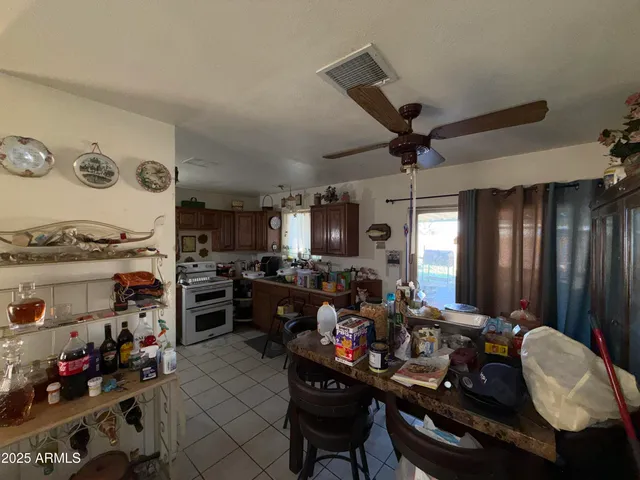 a room with furniture a chandelier and a window