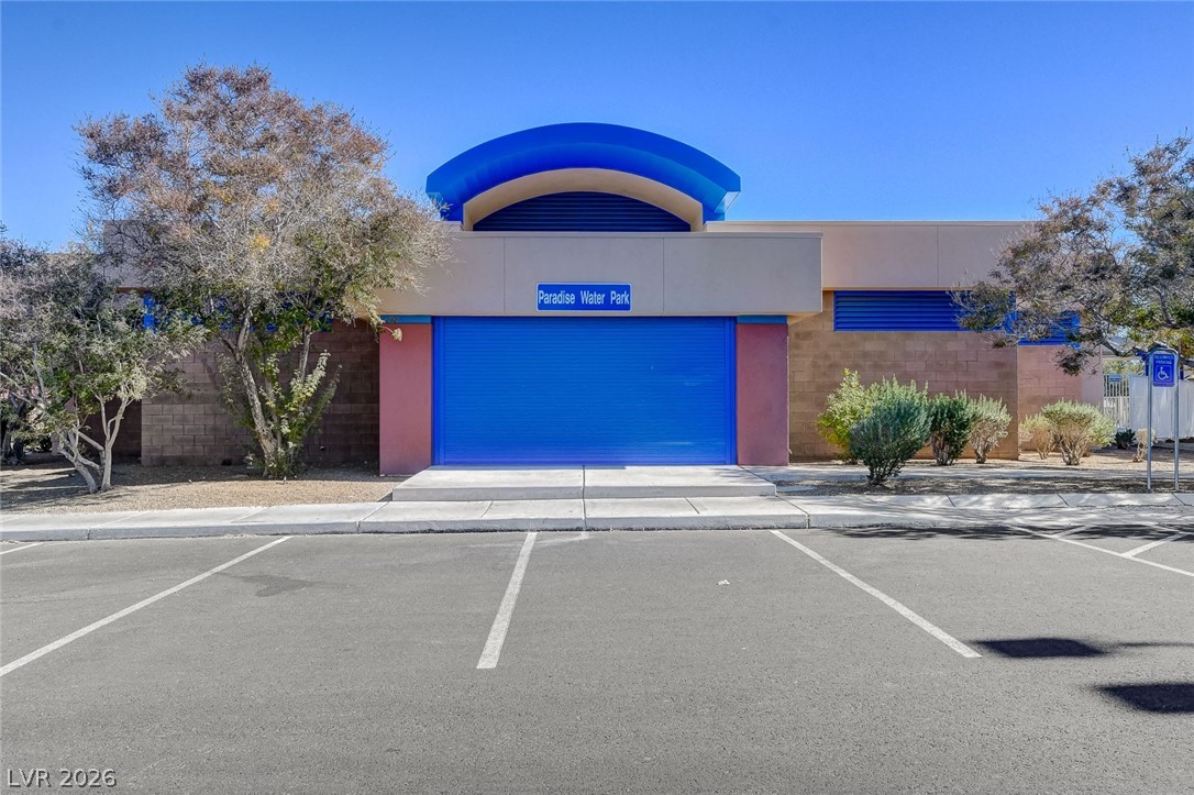 4840 Summerhill Road Las Vegas, NV 89121 - Photo 54 of 56 An inviting entrance to a water park, featuring bright blue architectural details and a welcoming facade.