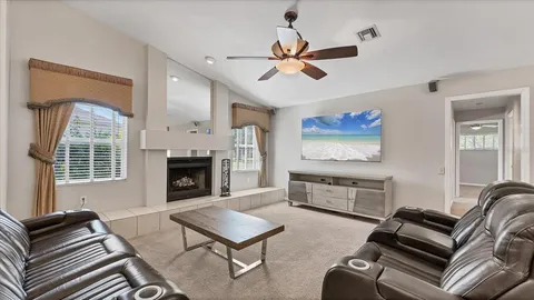 a white bath tub sitting next to a white toilet