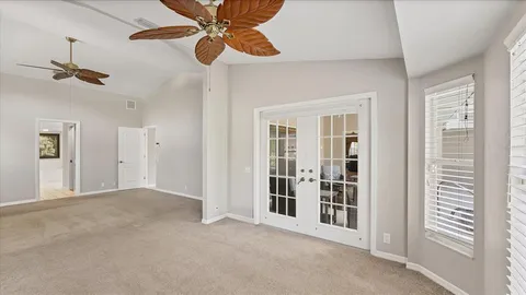 a white toilet sitting next to a bath tub
