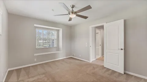 a balcony with furniture and a window