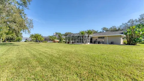 an aerial view of a house with a lake view