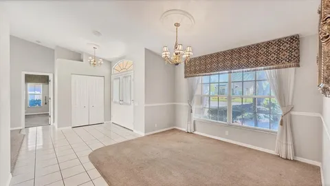 a view of a dining room with furniture window and outside view