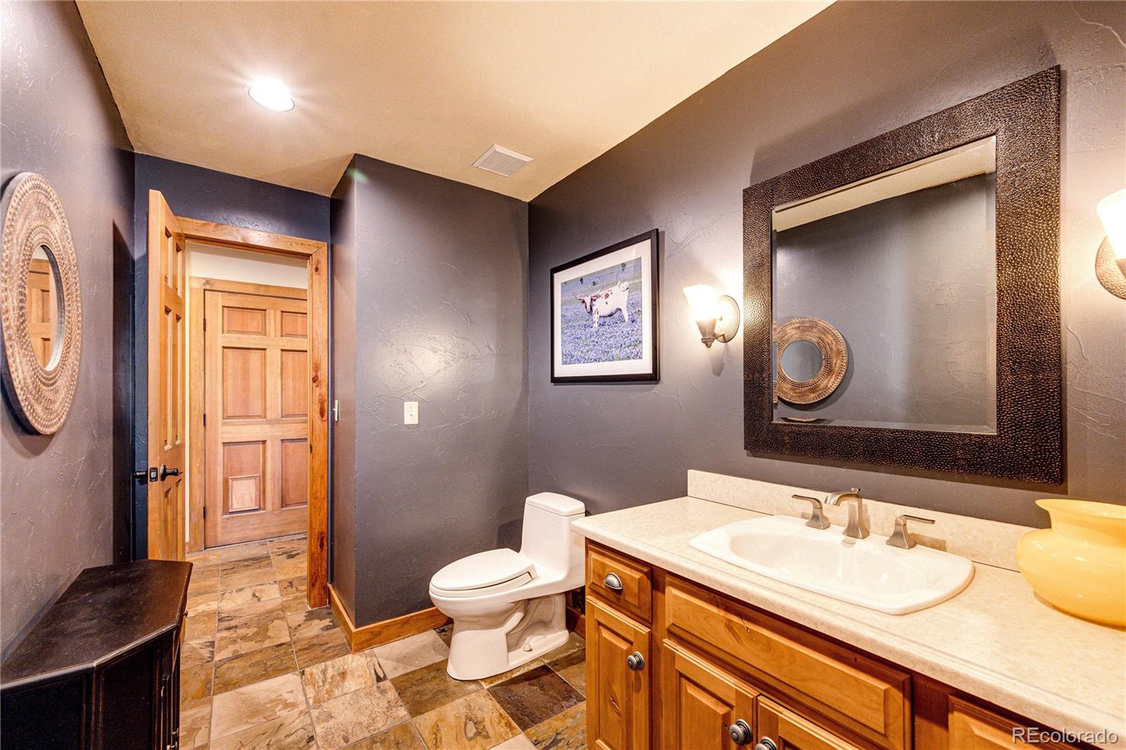 272 Greystone Road Evergreen, CO 80439 - Photo 17 of 40 a bathroom with a sink and a mirror