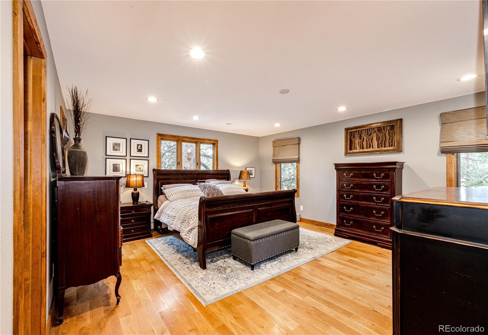 272 Greystone Road Evergreen, CO 80439 - Photo 20 of 40 a living room with furniture and a flat screen tv