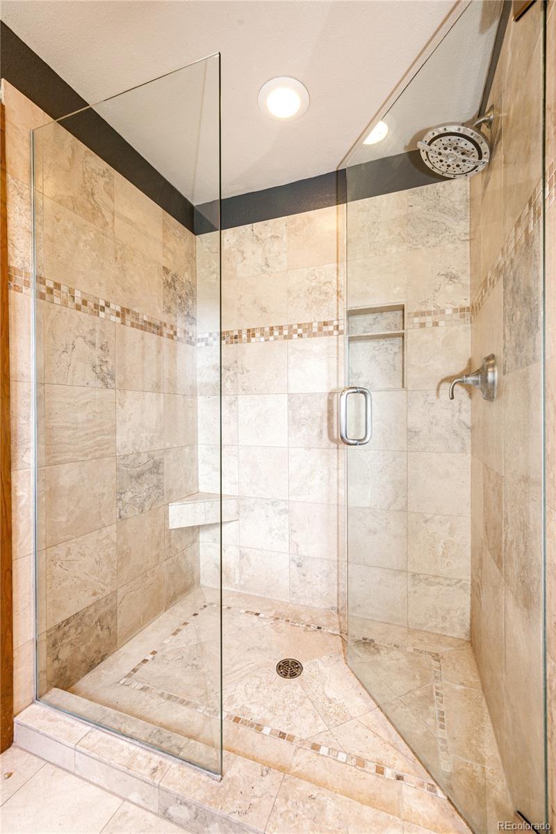 272 Greystone Road Evergreen, CO 80439 - Photo 24 of 40 a bathroom with a shower