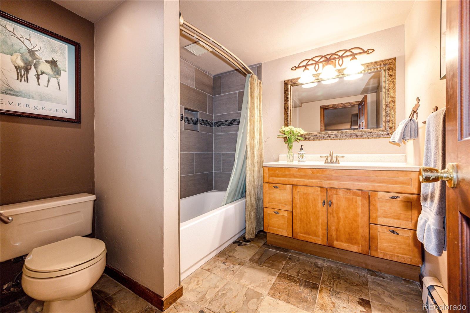 272 Greystone Road Evergreen, CO 80439 - Photo 33 of 40 a bathroom with a sink toilet and shower