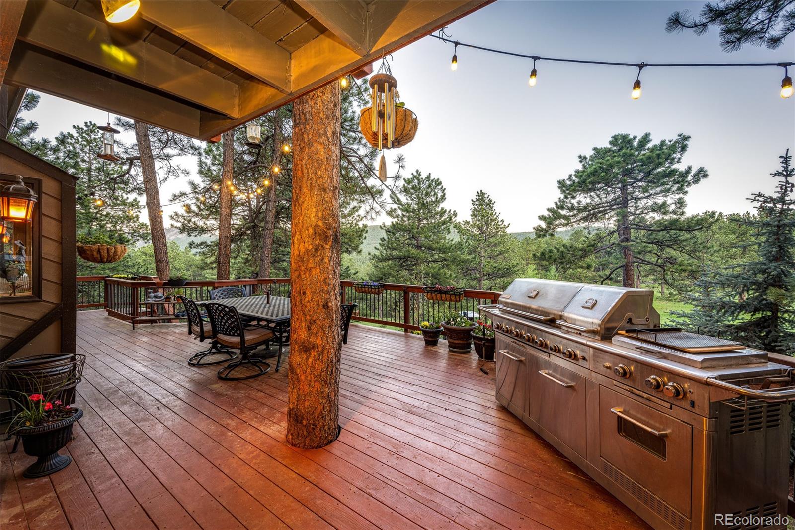 272 Greystone Road Evergreen, CO 80439 - Photo 34 of 40 a view of a patio with wooden floor