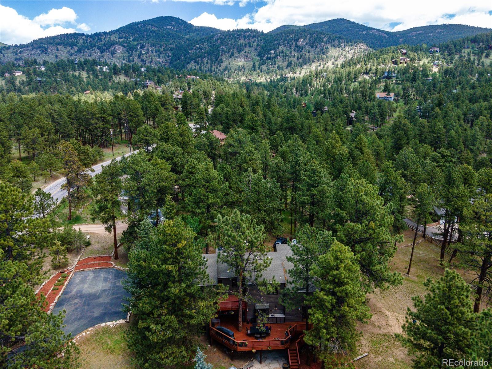 272 Greystone Road Evergreen, CO 80439 - Photo 4 of 40 an aerial view of a house with a yard