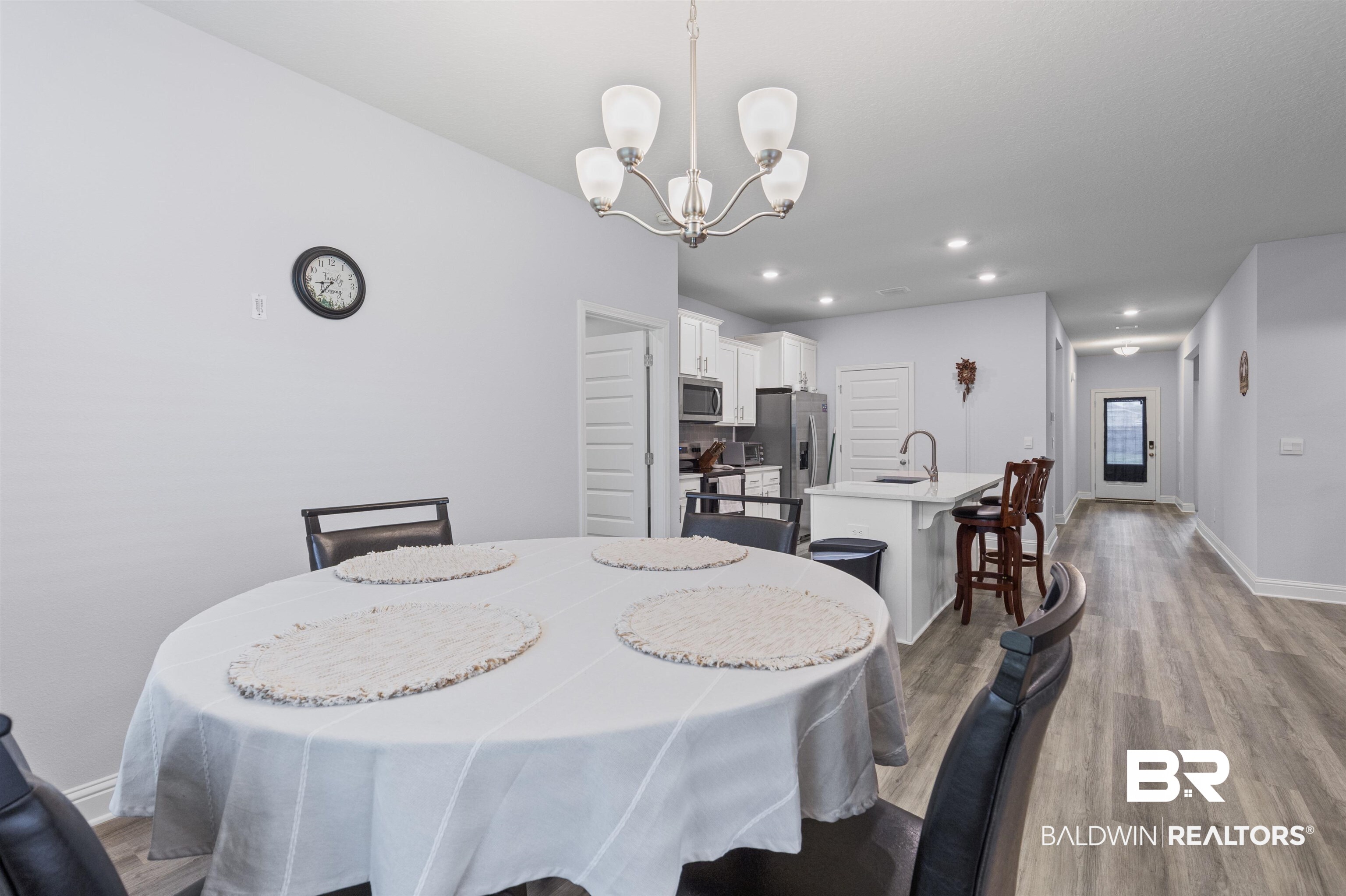 10564 Heirloom Road South Mobile, AL 36608 - Photo 12 of 24 Dining area with dark wood finished floors, recessed lighting, and a chandelier