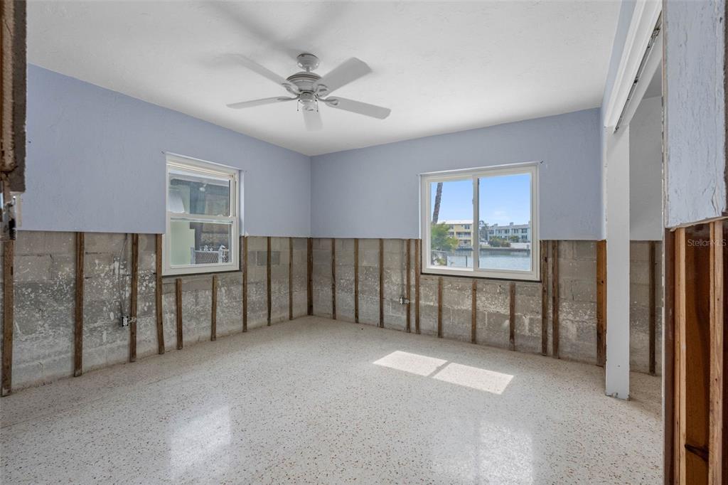 307 Bahia Vista Drive Indian Rocks Beach, FL 33785 - Photo 16 of 26 a view of an empty room with kitchen and a window