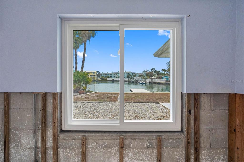 307 Bahia Vista Drive Indian Rocks Beach, FL 33785 - Photo 17 of 26 a view of a room that has a bed and a window