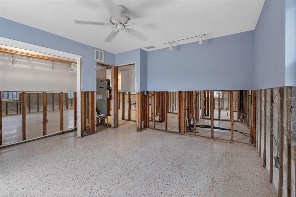 307 Bahia Vista Drive Indian Rocks Beach, FL 33785 - Photo 18 of 26 a view of an empty room with window and stairs