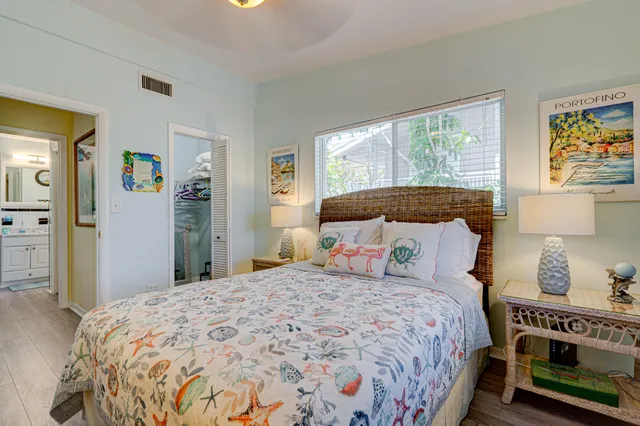 a bedroom with a large bed and a window