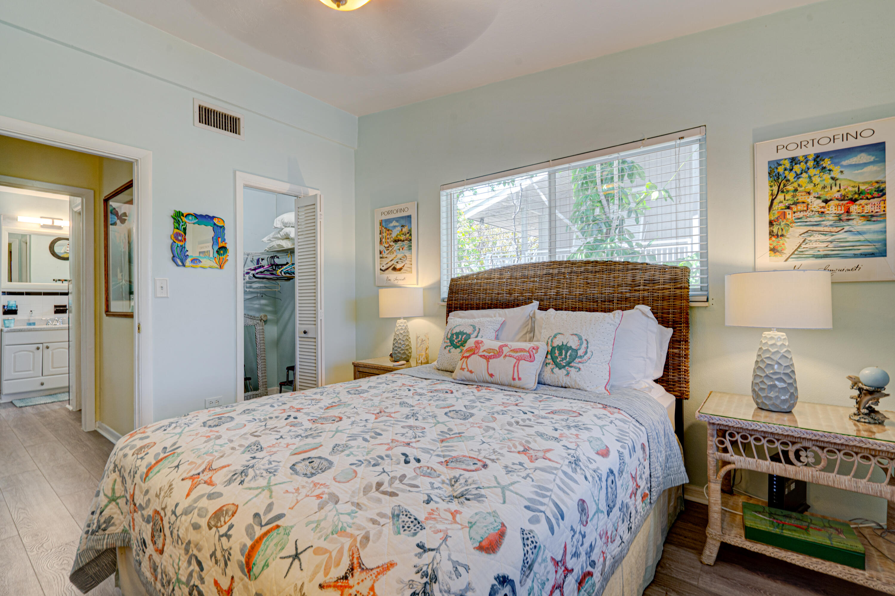 130 Plantation Avenue, Unit UPPR Tavernier, FL 33070 - Photo 12 of 34 a bedroom with a large bed and a window