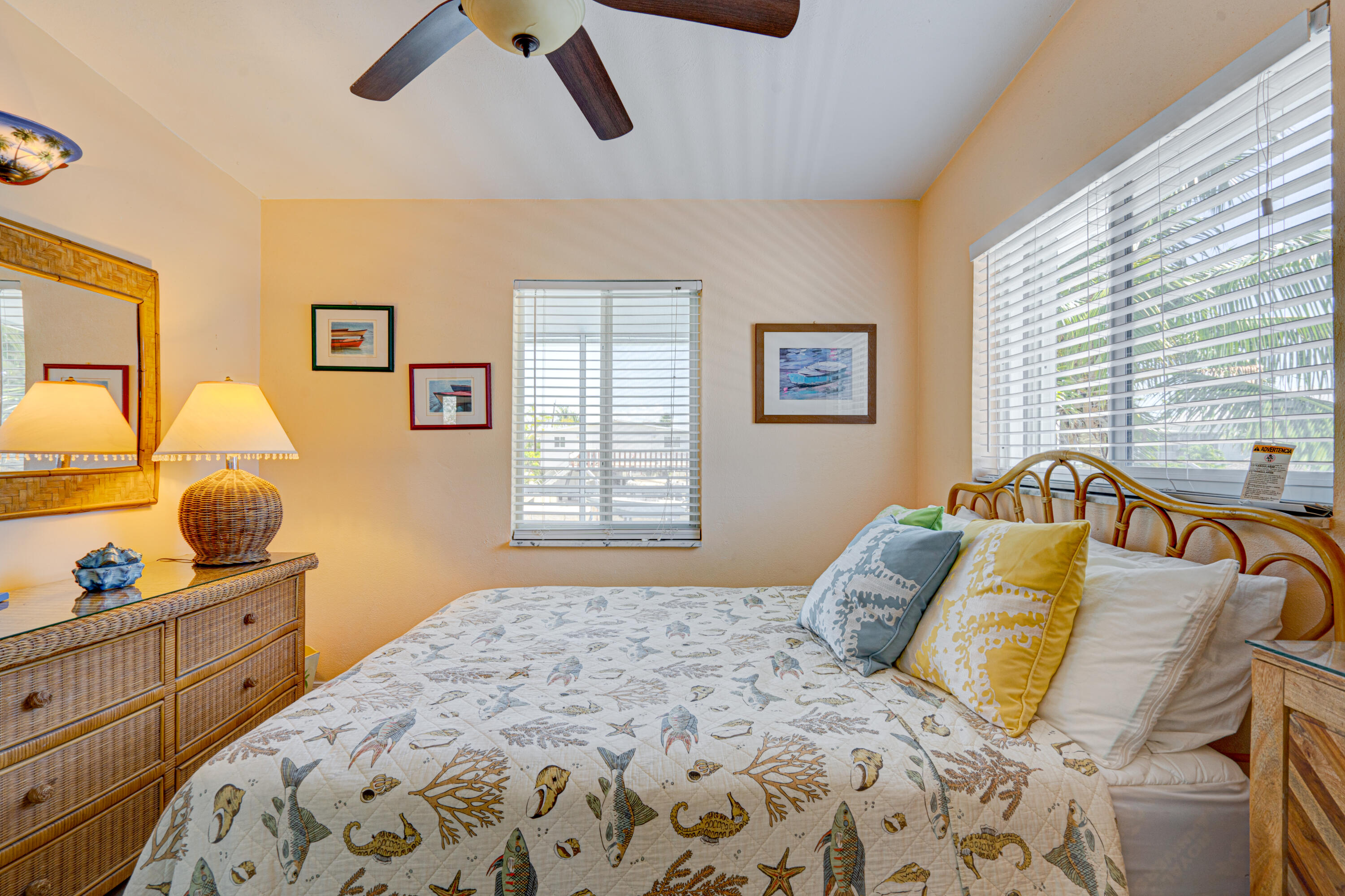 130 Plantation Avenue, Unit UPPR Tavernier, FL 33070 - Photo 16 of 34 a bedroom with a bed and window