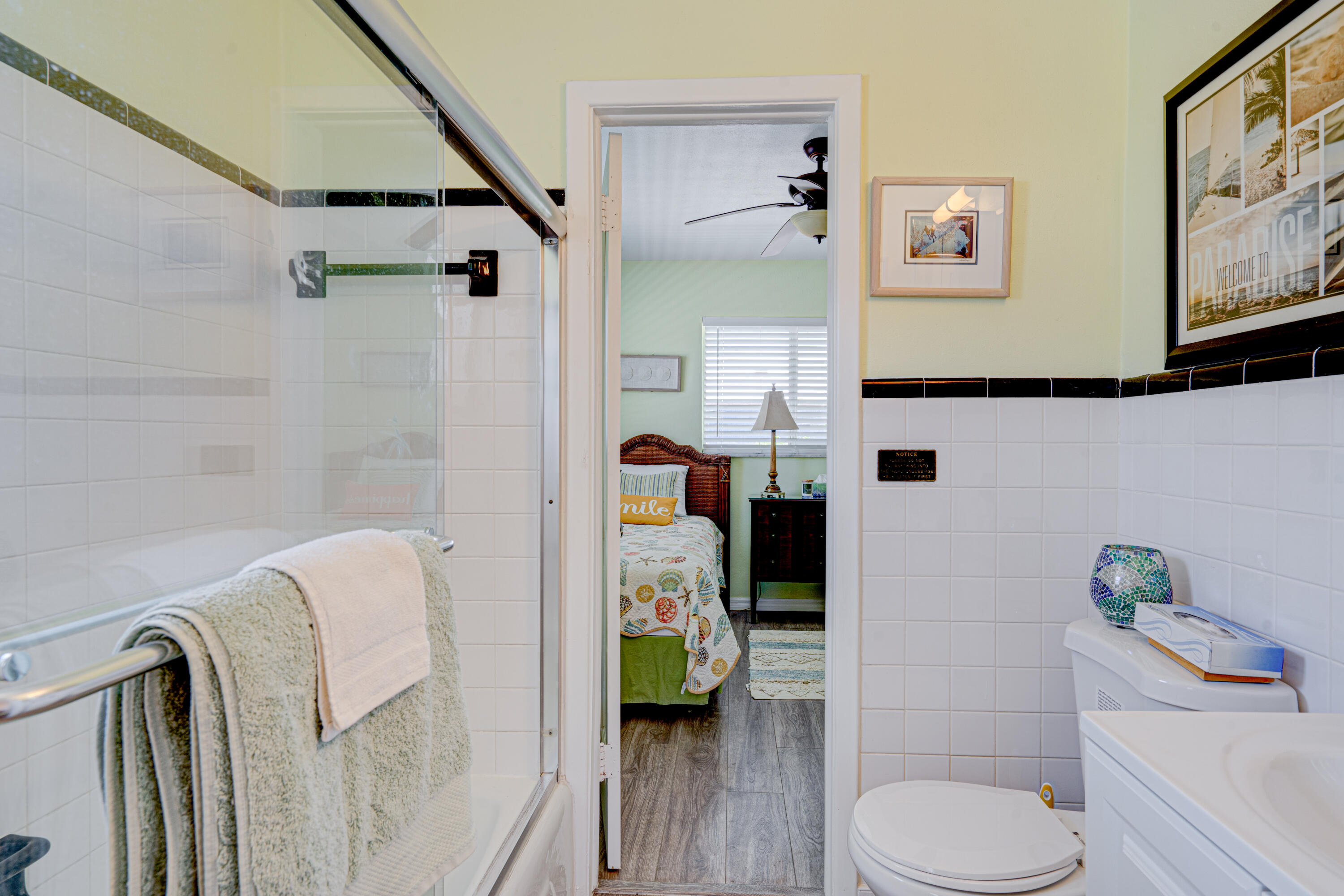 130 Plantation Avenue, Unit UPPR Tavernier, FL 33070 - Photo 19 of 34 a bathroom with a sink toilet and shower