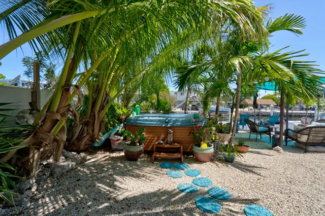 a view of a backyard with sitting area