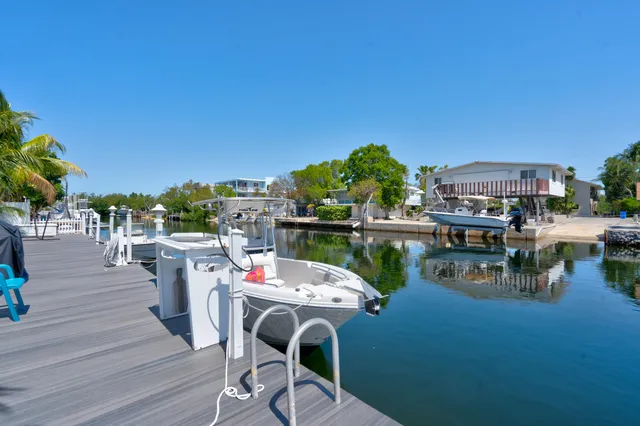 a outdoor living space with patio furniture and garden view