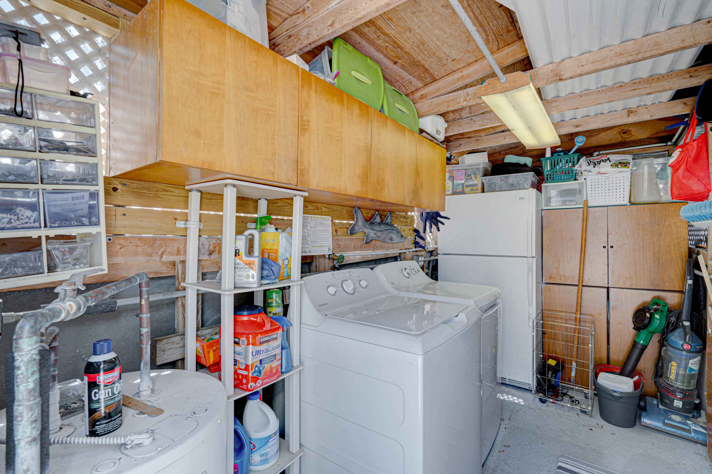130 Plantation Avenue, Unit UPPR Tavernier, FL 33070 - Photo 33 of 34 a utility room with dryer and washer