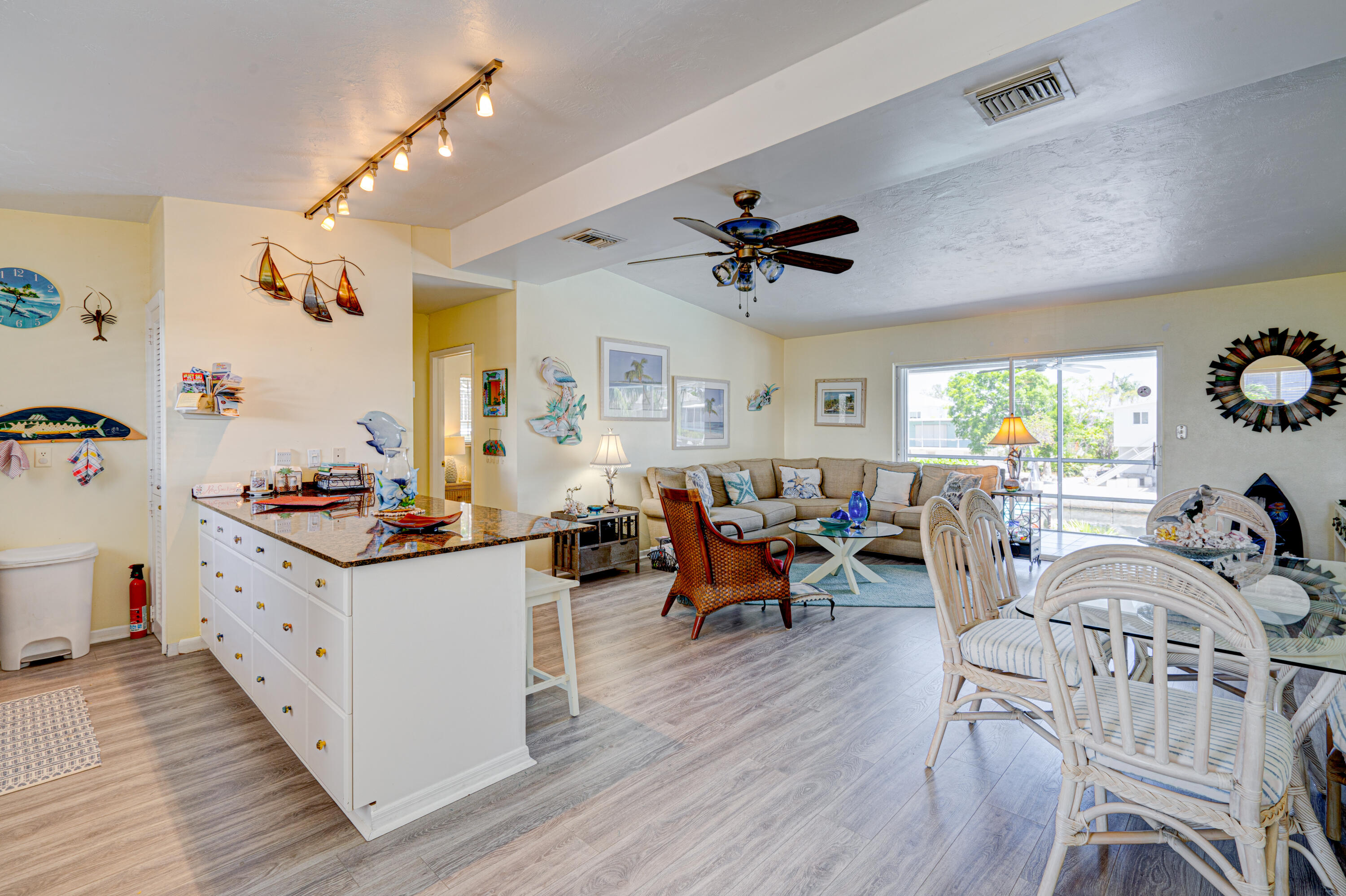 130 Plantation Avenue, Unit UPPR Tavernier, FL 33070 - Photo 6 of 34 a living room with furniture and wooden floor