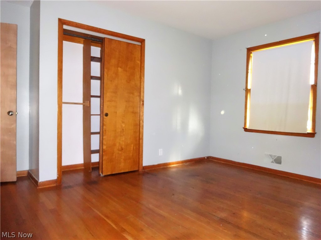3940 West Sprague Road Parma, OH 44134 - Photo 7 of 34 1st bedroom with closet and hardwood floor