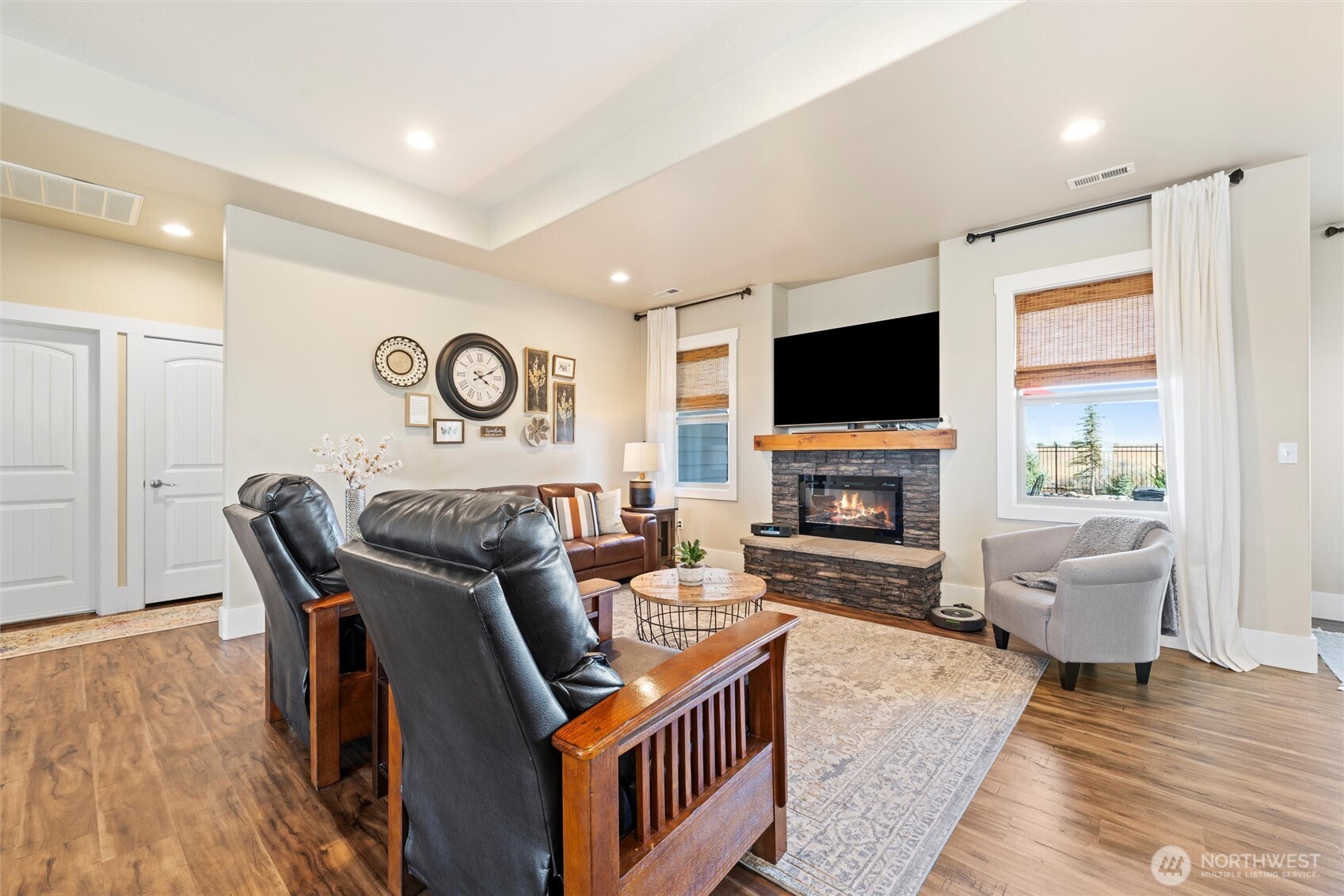8125 Dune Lake Road Southeast Moses Lake, WA 98837 - Photo 15 of 40 a living room with fireplace furniture and a flat screen tv
