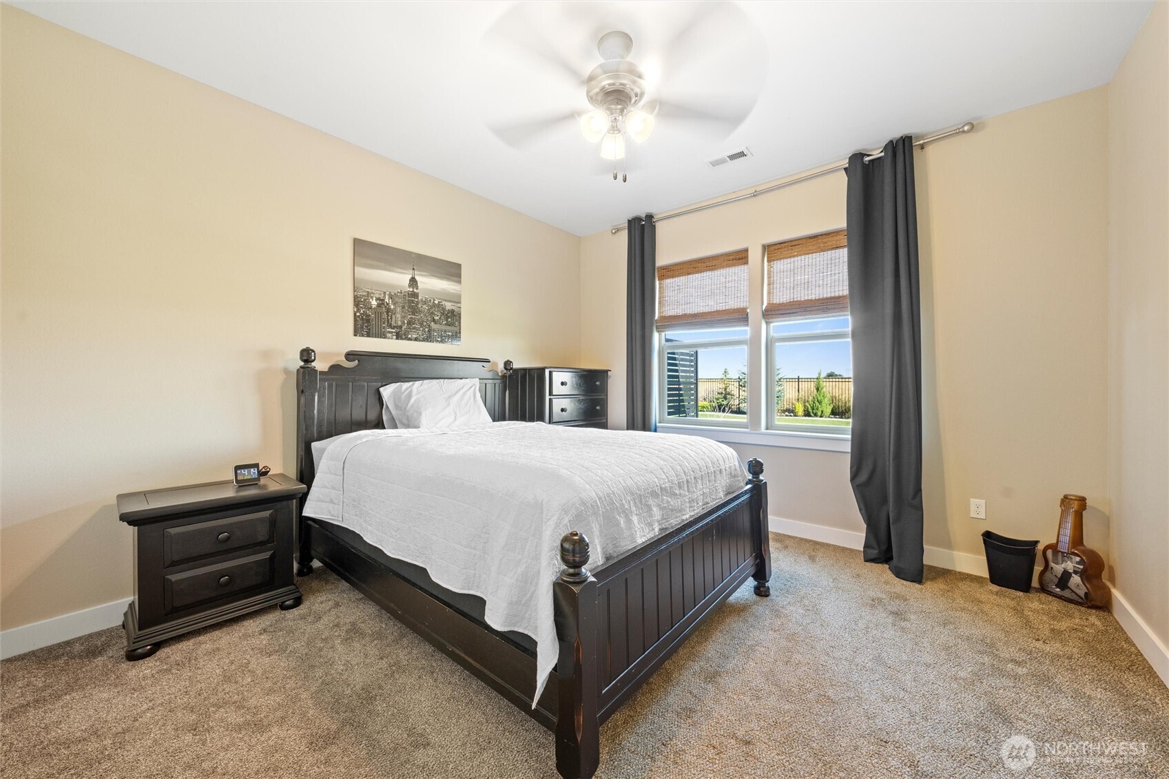 8125 Dune Lake Road Southeast Moses Lake, WA 98837 - Photo 19 of 40 a bedroom with a bed lamp and a window