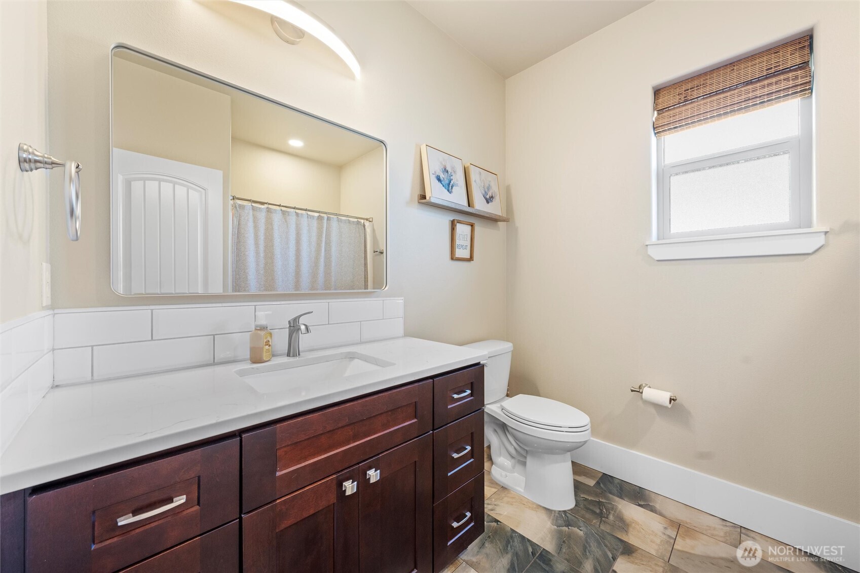 8125 Dune Lake Road Southeast Moses Lake, WA 98837 - Photo 20 of 40 a bathroom with a granite countertop sink a toilet and a mirror