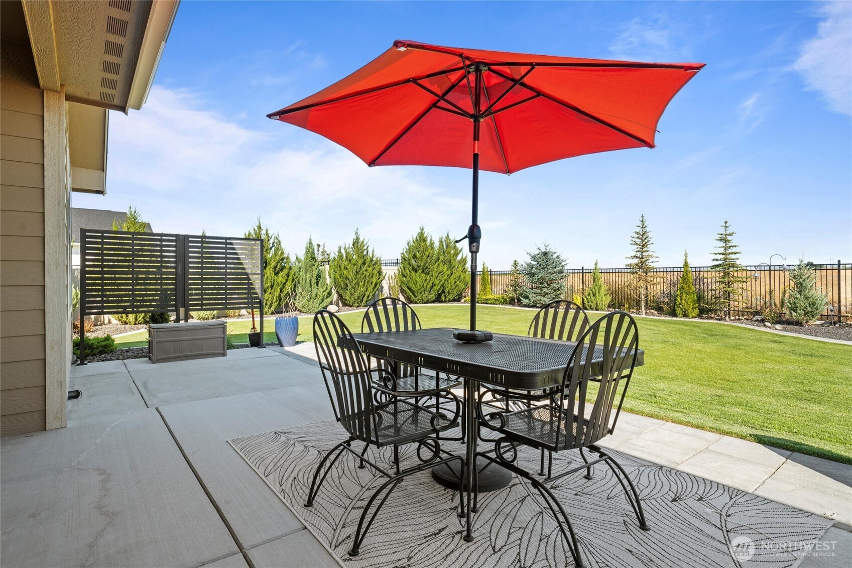 8125 Dune Lake Road Southeast Moses Lake, WA 98837 - Photo 39 of 40 a view of a patio with a table chairs and a swimming pool