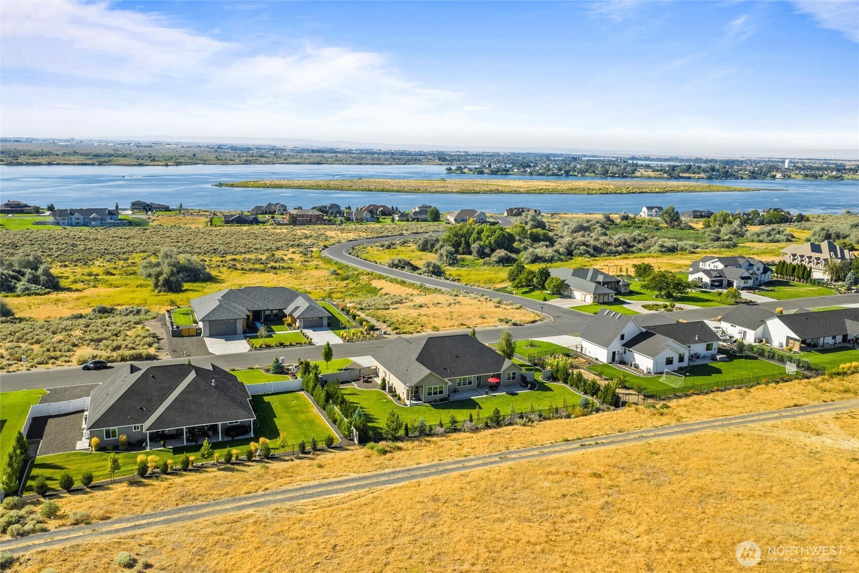 8125 Dune Lake Road Southeast Moses Lake, WA 98837 - Photo 4 of 40 an aerial view of residential houses with outdoor space