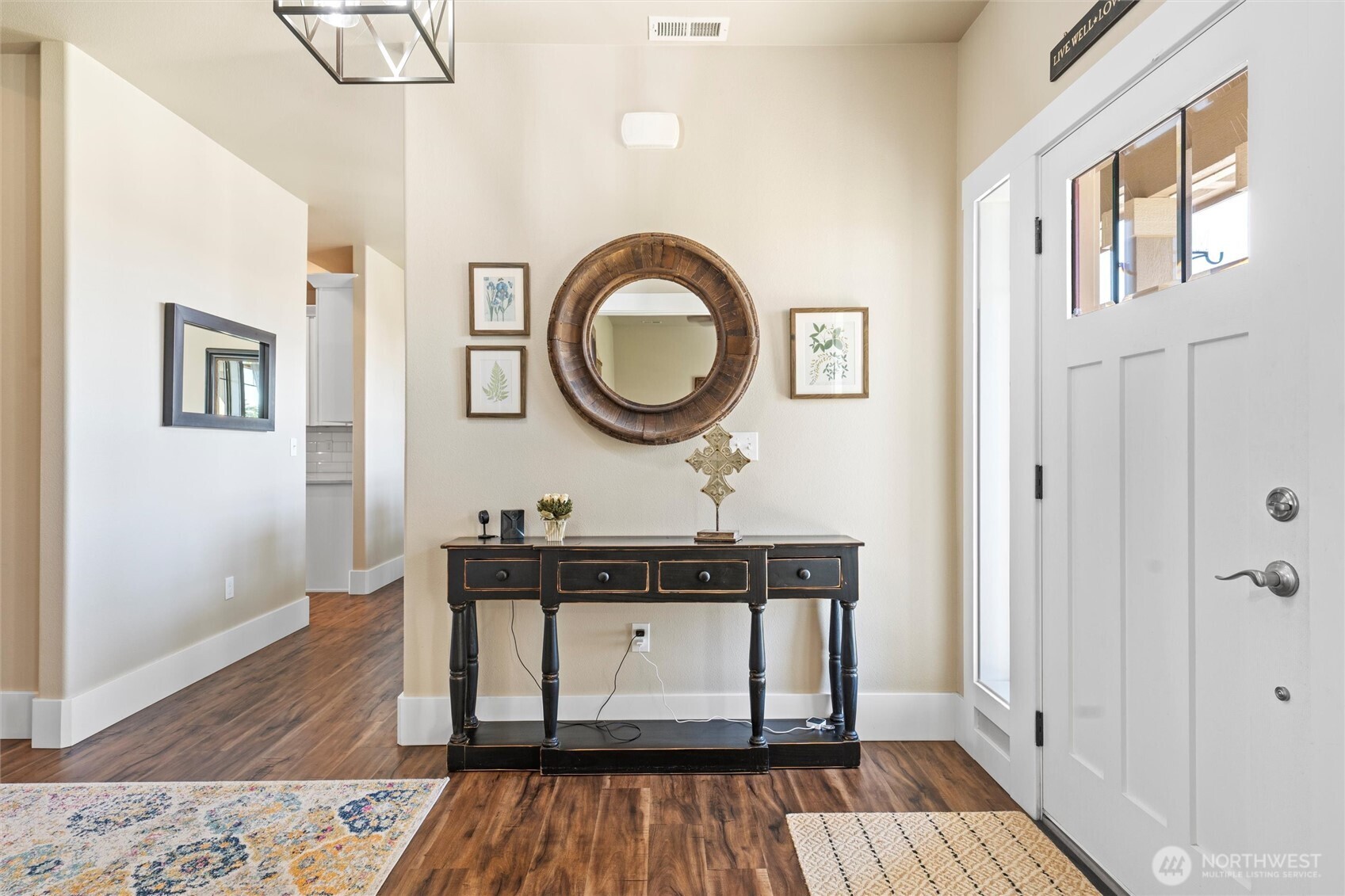 8125 Dune Lake Road Southeast Moses Lake, WA 98837 - Photo 6 of 40 a bathroom with a sink a mirror and wooden floor