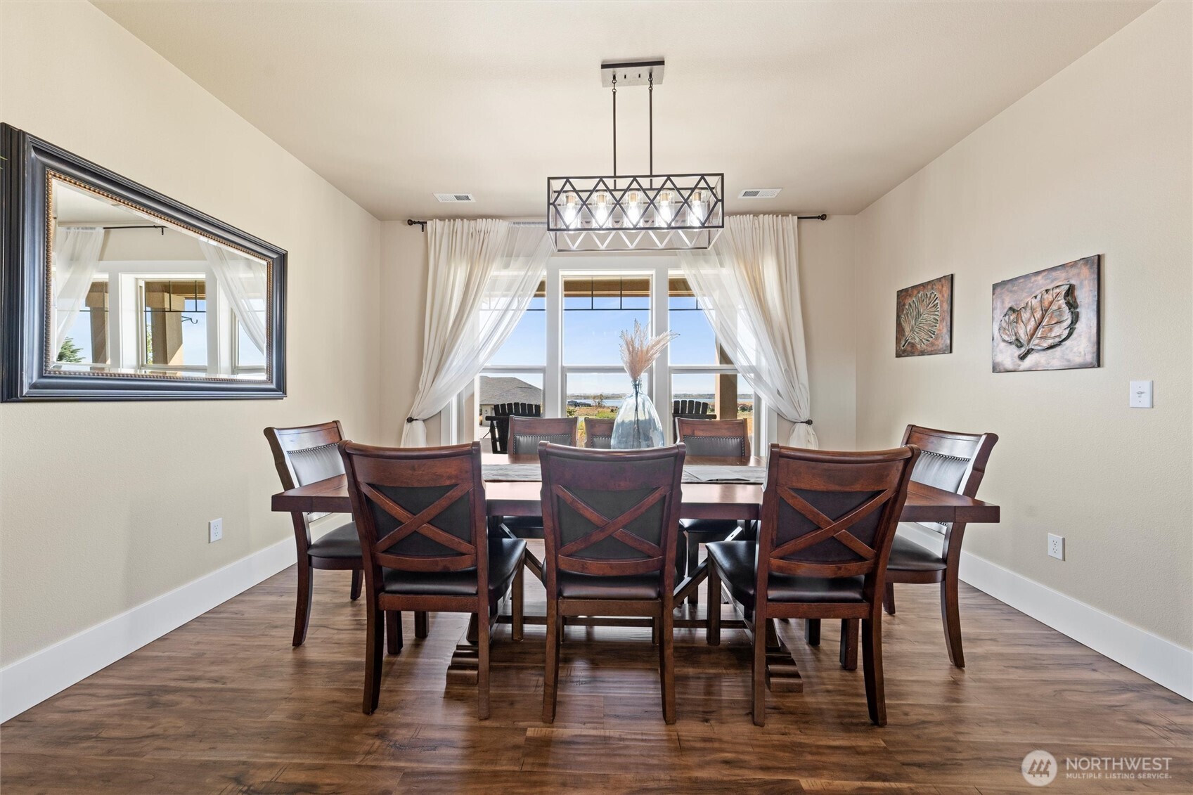 8125 Dune Lake Road Southeast Moses Lake, WA 98837 - Photo 8 of 40 a view of a dining room with furniture window and wooden floor