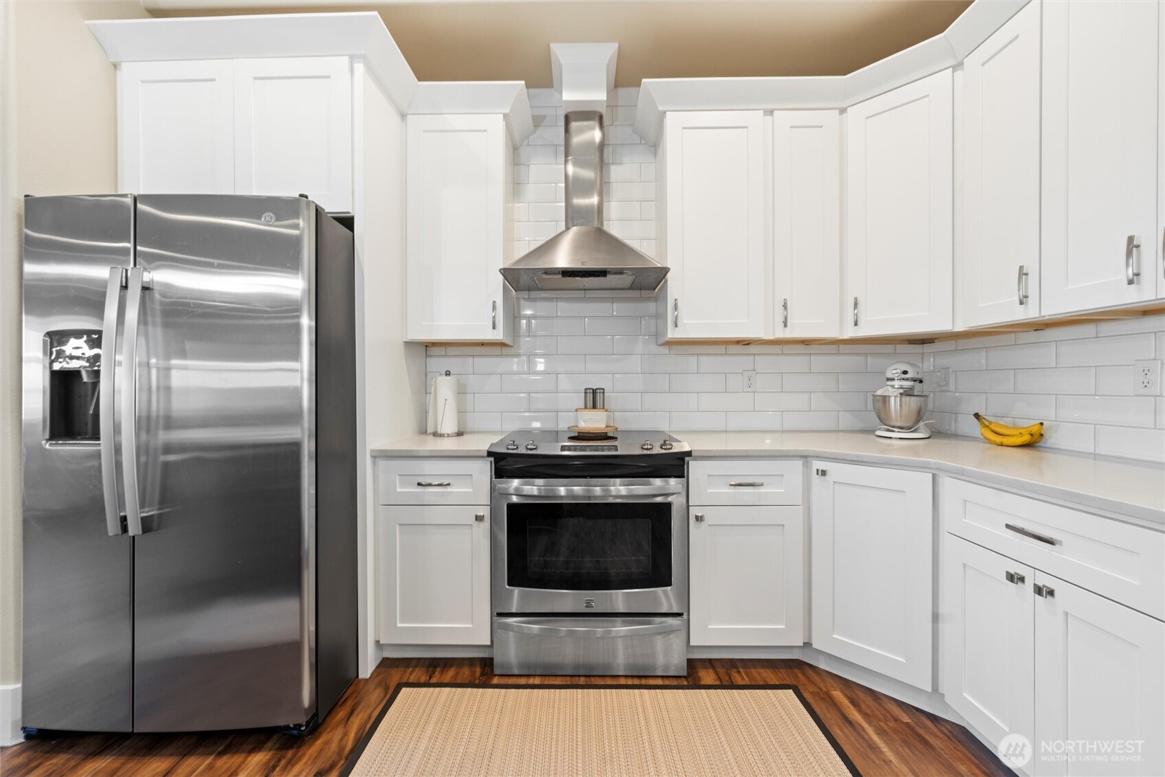 8125 Dune Lake Road Southeast Moses Lake, WA 98837 - Photo 10 of 40 a kitchen with stainless steel appliances granite countertop a stove a refrigerator and a white cabinets