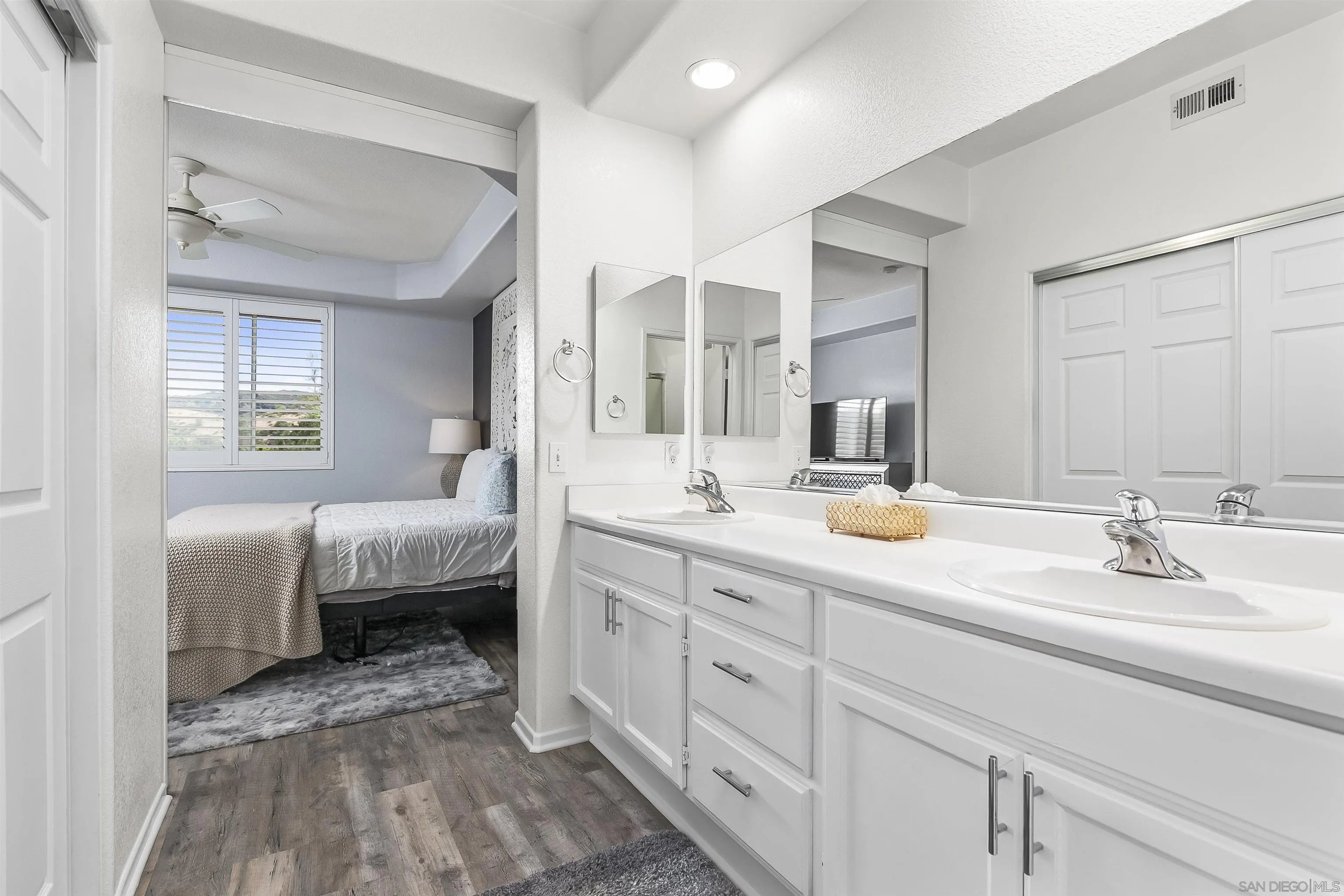 3177 Dehesa Road El Cajon, CA 92019 - Photo 19 of 55 a bathroom with double vanity sinks and a mirror