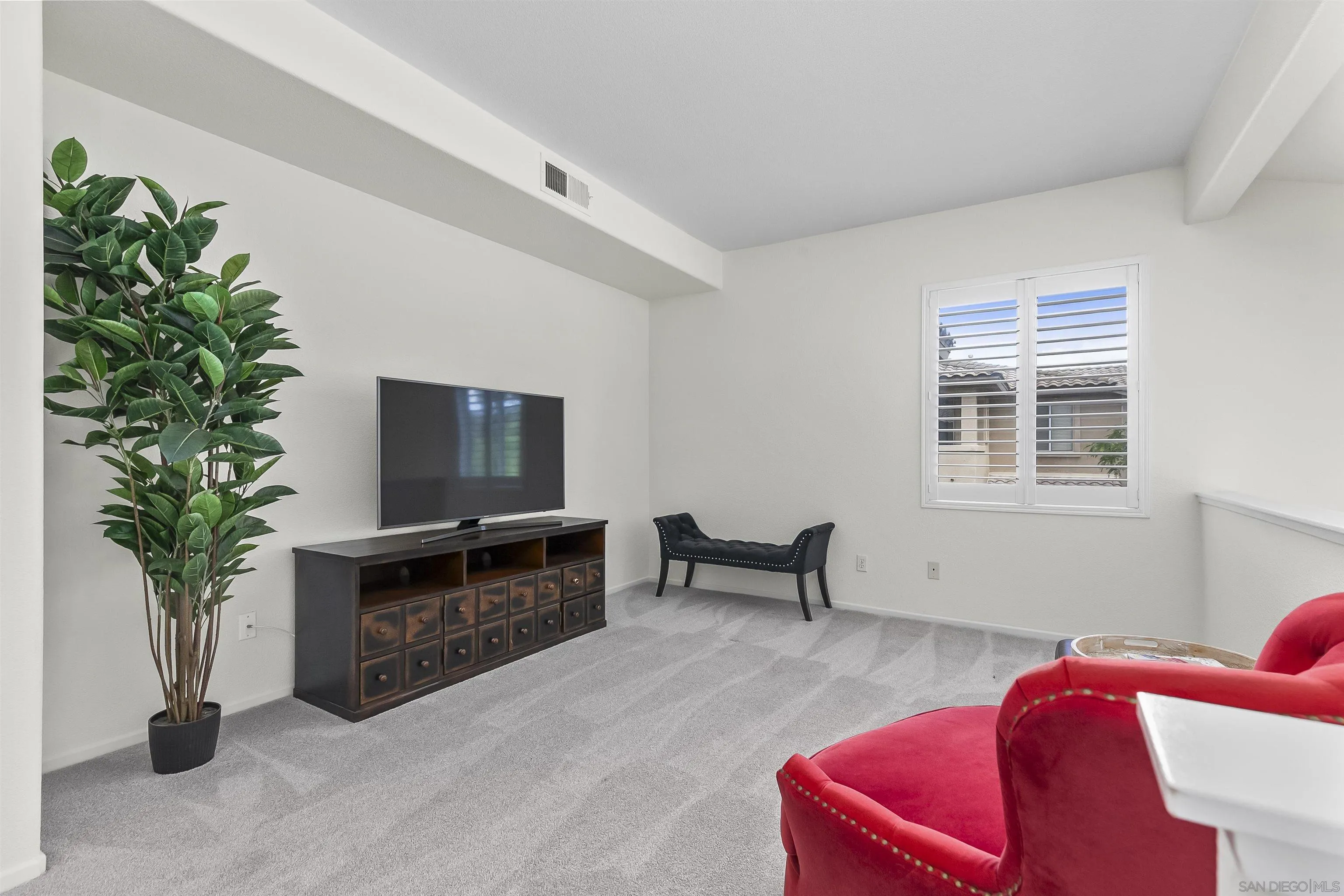 3177 Dehesa Road El Cajon, CA 92019 - Photo 23 of 55 a living room with furniture a potted plant and a fireplace
