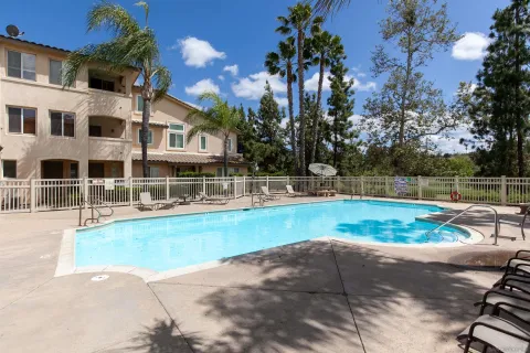 an aerial view of a house with a mountain