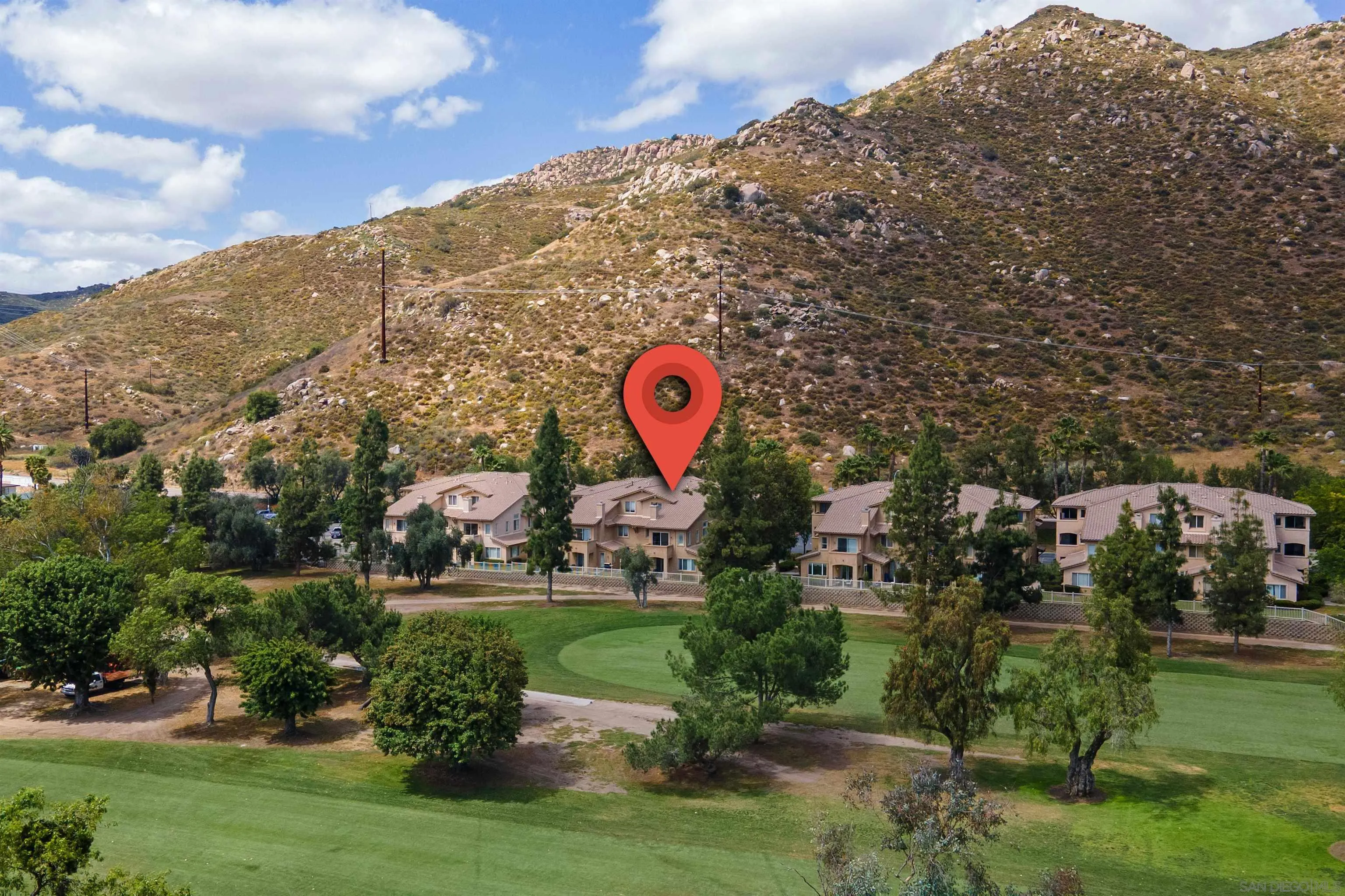 3177 Dehesa Road El Cajon, CA 92019 - Photo 50 of 55 a view of a park with a building and mountains in the background