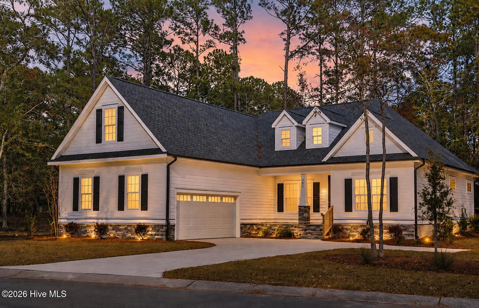 992 Ashburton Road Southeast Bolivia, NC 28422 - Photo 1 of 78 Front view at sunset