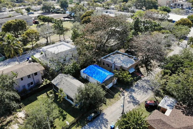an aerial view of a house with a garden