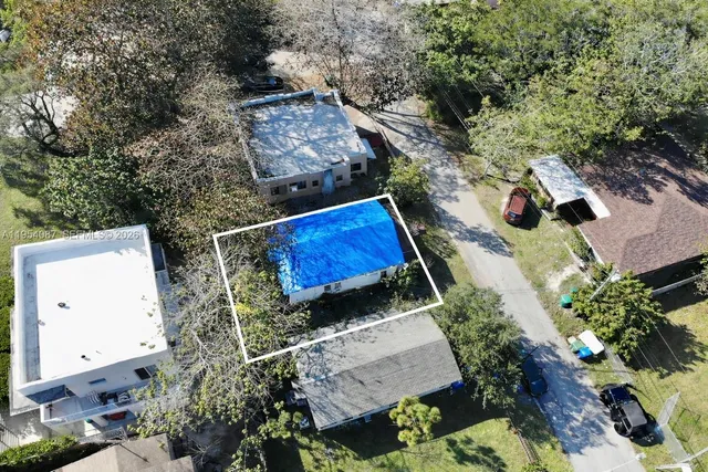 an aerial view of a house with outdoor space