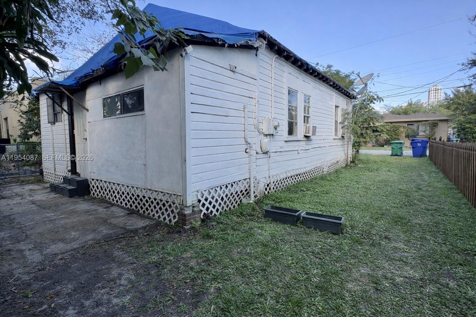 3748 Washington Avenue Miami, FL 33133 - Photo 4 of 15 a view of a house with a yard