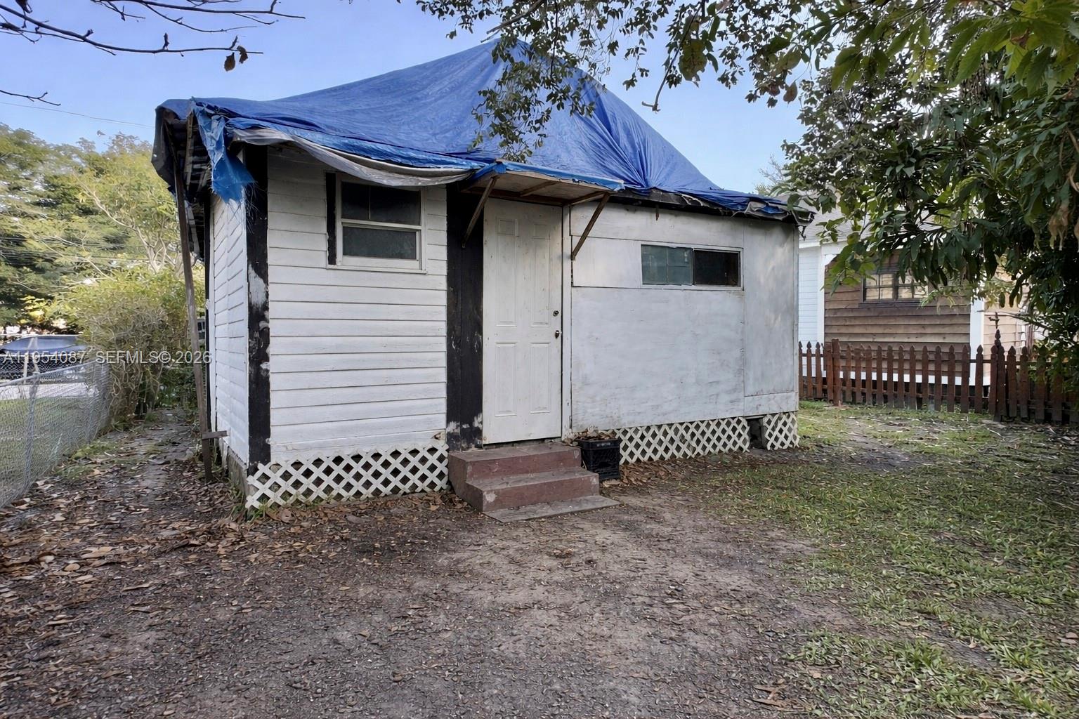3748 Washington Avenue Miami, FL 33133 - Photo 5 of 15 a front view of a house with a garden