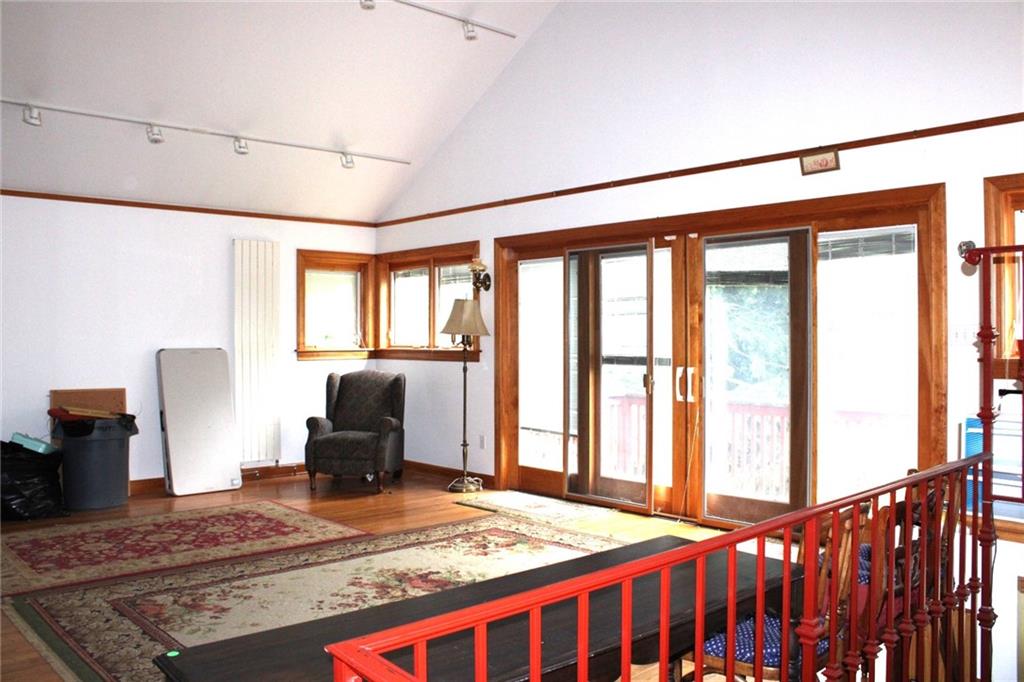 200 School Street Pittsburgh, PA 15205 - Photo 11 of 46 a bedroom with a bed and wooden floor