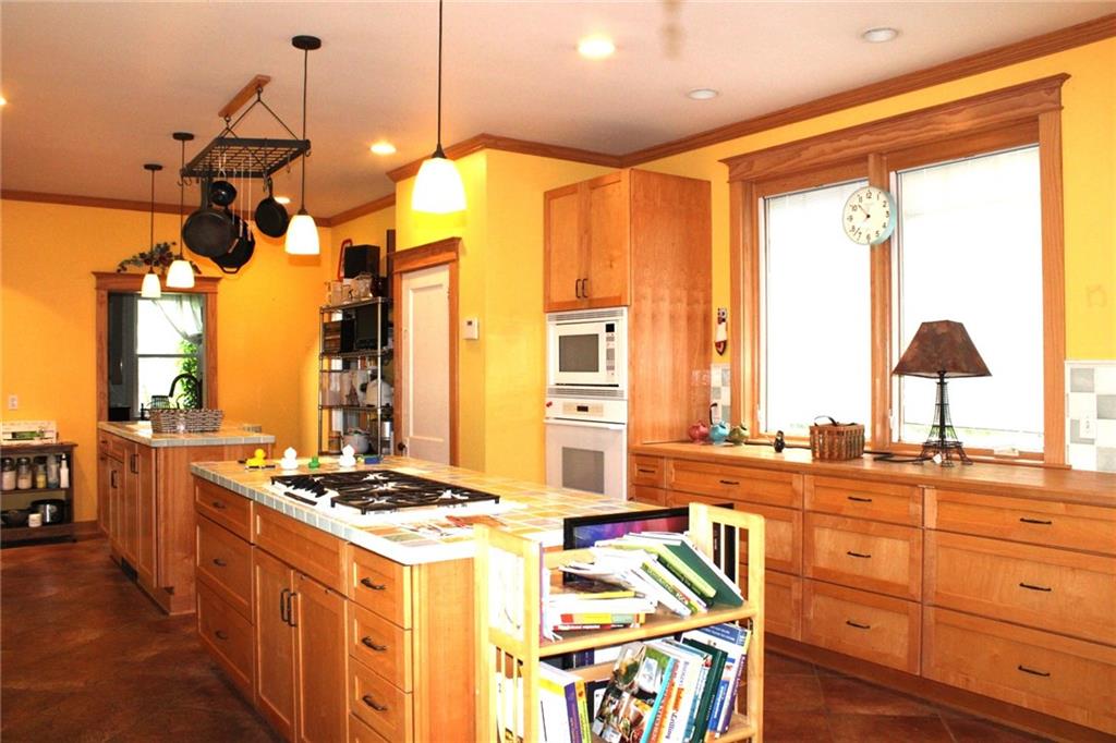 200 School Street Pittsburgh, PA 15205 - Photo 15 of 46 a kitchen with a stove a sink and a refrigerator