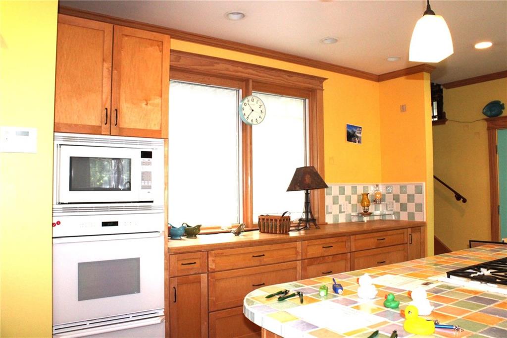 200 School Street Pittsburgh, PA 15205 - Photo 16 of 46 a kitchen with a stove a sink and a refrigerator