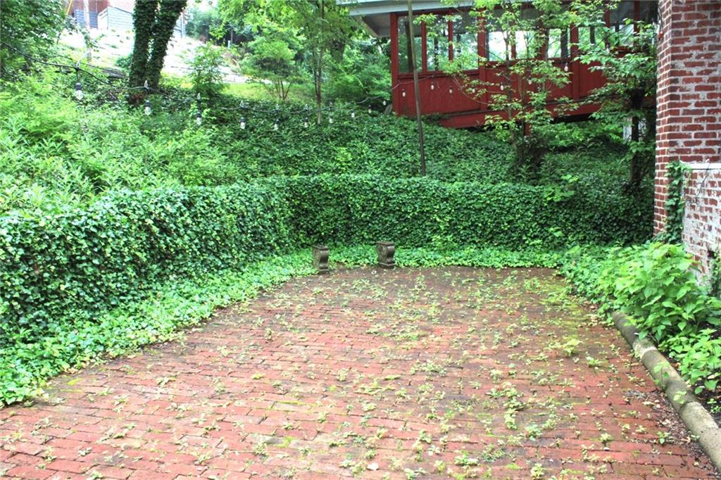 200 School Street Pittsburgh, PA 15205 - Photo 25 of 46 a view of a yard with plants and a bench
